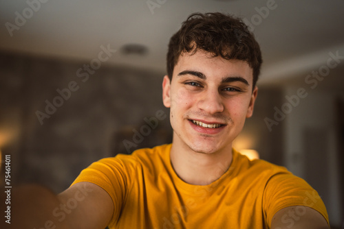 Portrait of young caucasian teen male young man stand at home