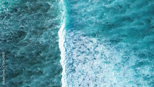 Beautiful texture of big power dark ocean waves with white wash. Aerial top view footage of fabulous sea tide on a stormy day. Drone filming breaking surf with foam in Caribbean Sea photo