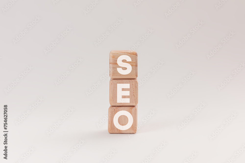 Wooden blocks with letters spelling SEO, representing Search Engine Optimization, isolated on a white background. The blocks highlighting concept of online marketing and website ranking strategies Wooden blocks with letters spelling SEO, representing Search Engine Optimization, isolated on a white background. The blocks highlighting concept of online marketing and website ranking strategies