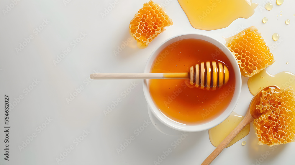 Sweet honey displayed in a bowl, surrounded by dippers and combs, all set against a clean white background. - obrazy, fototapety, plakaty 