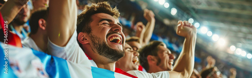 Slovenian football soccer fans in a stadium supporting the national team 