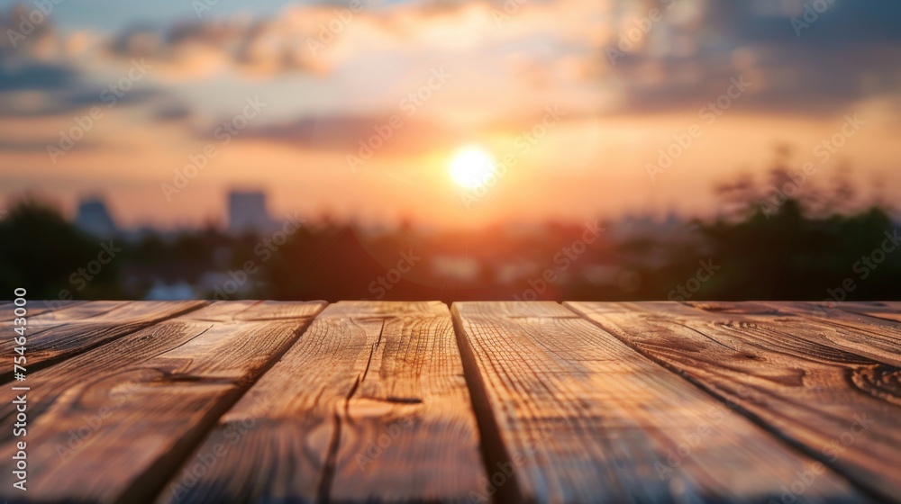 Wooden table top with copy space. Sunset background Wooden table top with copy space. Sunset background