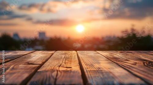 Wooden table top with copy space. Sunset background