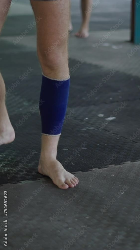Feet of a Caucasian man hits a bag Feet of a Caucasian man hits a bag