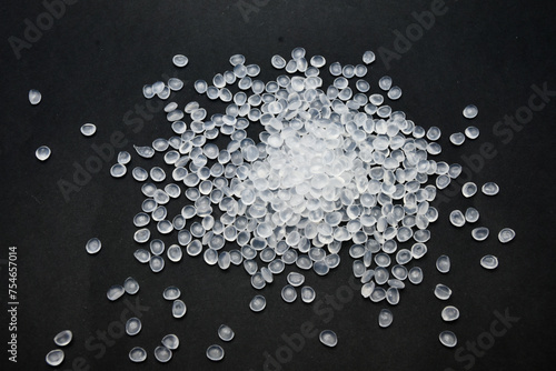 Virgin polypropylene (PP) granules on a black background, this polymer is one of the main materials in the plastics industry photo