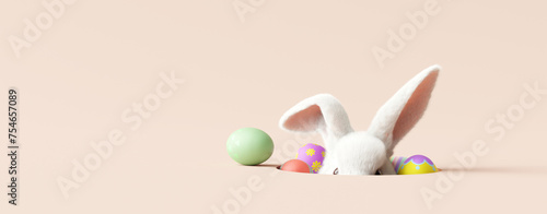 Easter bunny peeking out of a hole on cream color background. 3d rendering