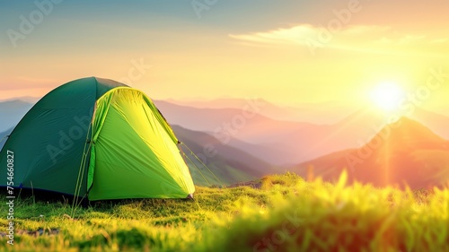 A lone tent facing a serene mountain sunrise with vibrant colors