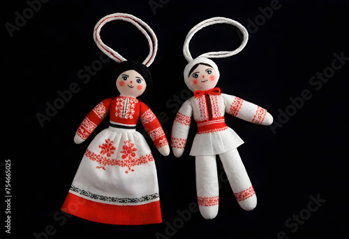 two martenitsa dolls in traditional ukrainian clothing photo