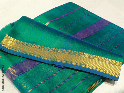 Handmade Indian sari, saree with golden details, woman wear on festival, ceremony and weddings, expensive sarees are famous for their gold and silver zari, Incredible India. photo
