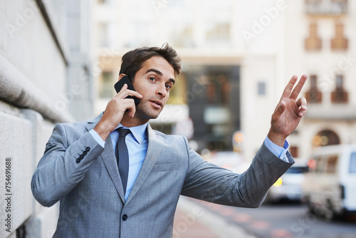 Phone call, street in city and taxi with businessman hailing ride outdoor for travel, transport or commute. Mobile, communication and networking with young employee calling cab in suit on sidewalk photo