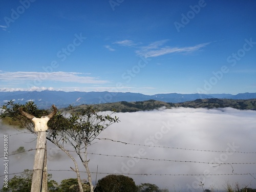 Horns, valey about clouds photo