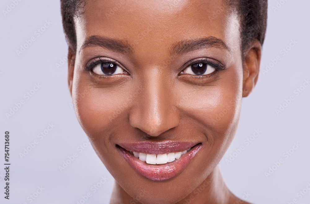 Dermatology, cosmetics and portrait of black woman with smile, glowing skin and natural spa makeup in studio. Happy, beauty and luxury skincare with healthy face of girl isolated on purple background Dermatology, cosmetics and portrait of black woman with smile, glowing skin and natural spa makeup in studio. Happy, beauty and luxury skincare with healthy face of girl isolated on purple background