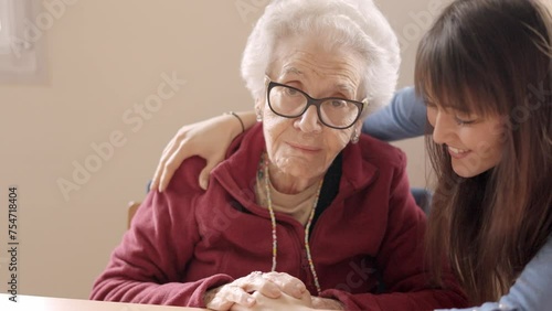 Granddaughter cheers up her sad grandmother in a nursing home