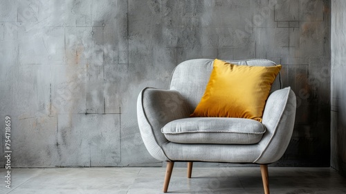 Modern armchair with light gray linen cover and yellow pillow