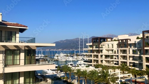 Modern apartment living with ocean views and marina with boats in the background. Bay of Kotor. Seaside town of Porto Montenegro, Tivat, Montenegro. Europe. photo