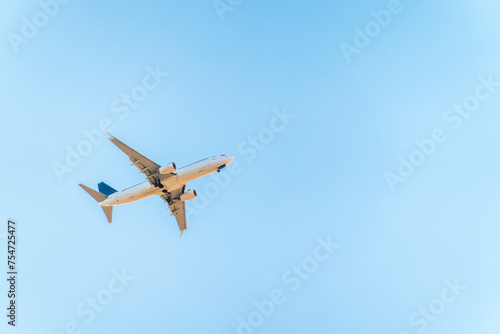 Airplane before landing in blue sky, Boeing 737-800