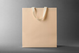 One paper bag on grey background. Mockup for design