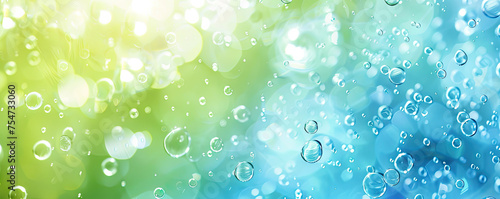 Abstract spring background featuring blue, cyan, and green bubbles with color transitions.