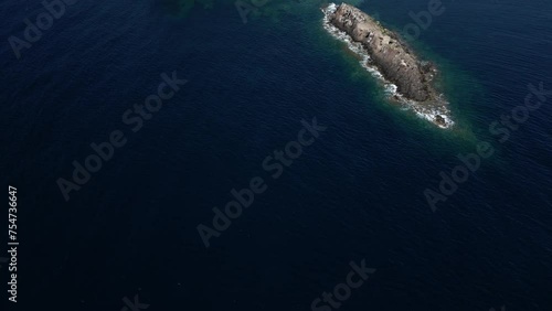 Panorama of the coast of Pula in Sardinia. Crystal clear sea and clouds in the distance photo