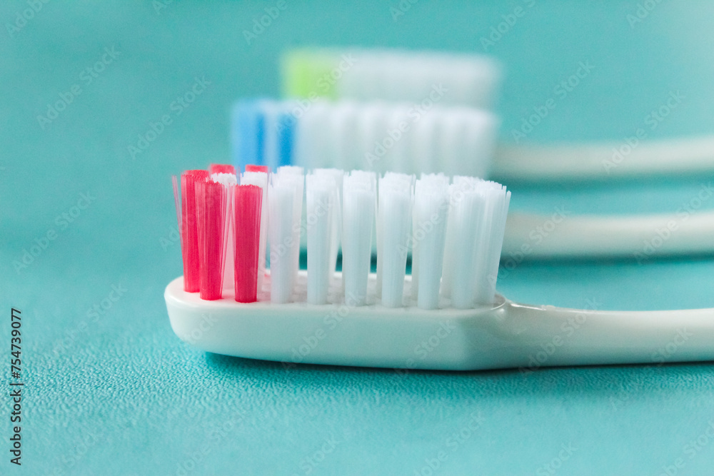 several toothbrushes on a blue background several toothbrushes on a blue background