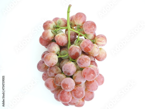 Ripe red grapes on white background.