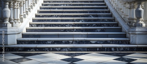 A set of marble stairs extends upward to the entrance of a grand building, elegant in its design and construction. The stairs stand as a symbol of opulence and sophistication.