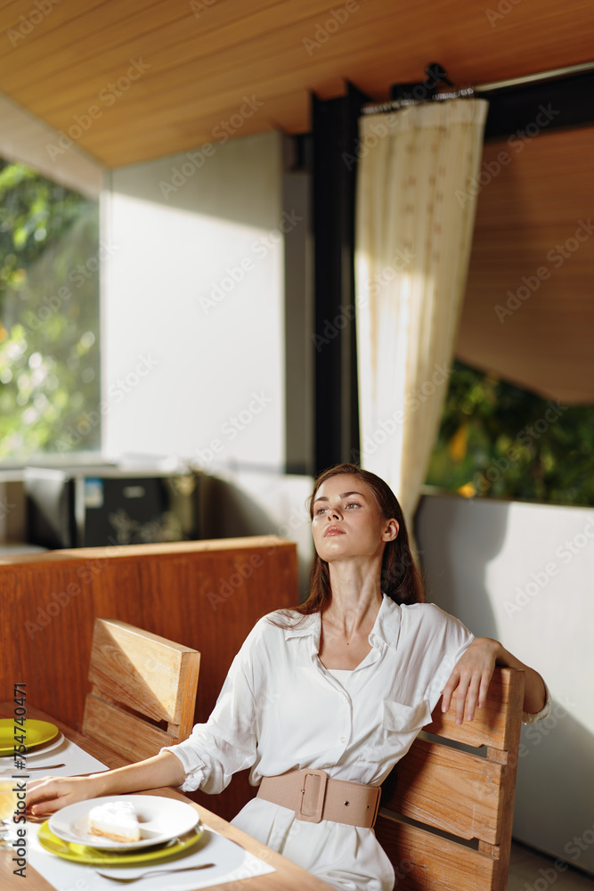 Romantic Dinner Date at Home Woman Smiling in Ecstasy as She Indulges in a Stylishly Set Table with Delicious Food, Cake, and Wine The Dining Room Creates a Cozy and Elegant Atmosphere, Perfect for Romantic Dinner Date at Home Woman Smiling in Ecstasy as She Indulges in a Stylishly Set Table with Delicious Food, Cake, and Wine The Dining Room Creates a Cozy and Elegant Atmosphere, Perfect for