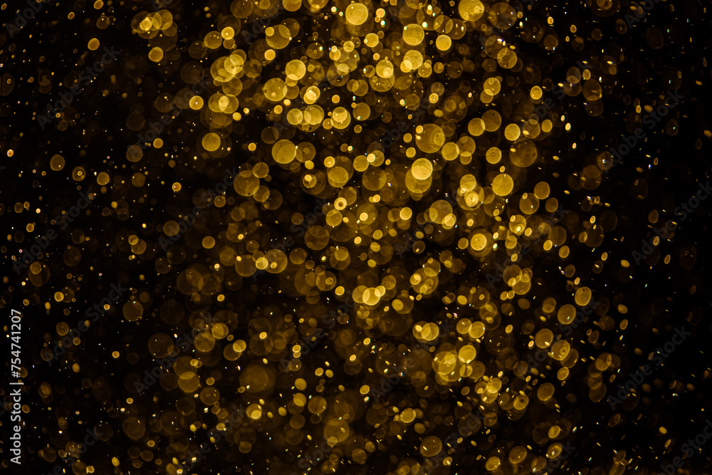 Blurred photo with golden dots visible glittering, shining brightly look and feel luxurious Blurred photo with golden dots visible glittering, shining brightly look and feel luxurious