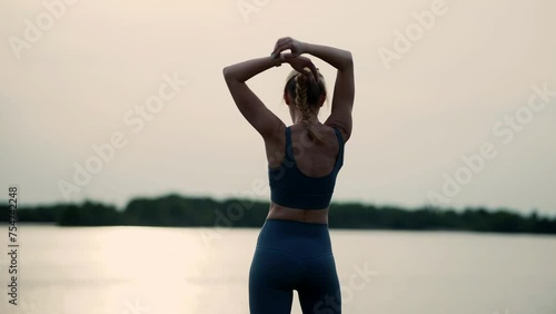 Woman stretching and warming-up . Female training in sportswear	 photo