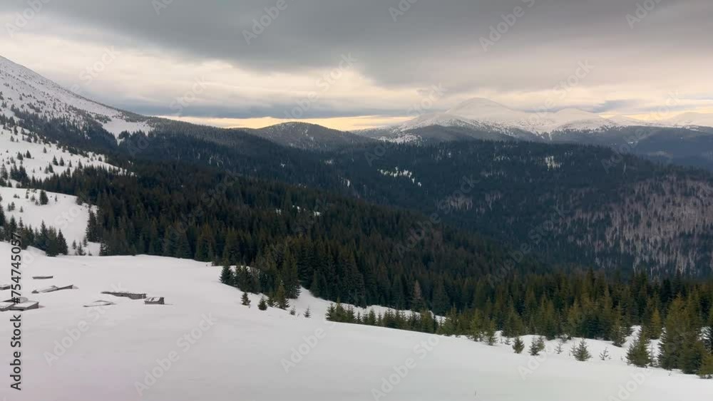 Germaneska meadow in the Carpathians, Ukraine, in the summer live shepherds of cows and sheep, and in winter fog and snowfall cover the roof Germaneska meadow in the Carpathians, Ukraine, in the summer live shepherds of cows and sheep, and in winter fog and snowfall cover the roof