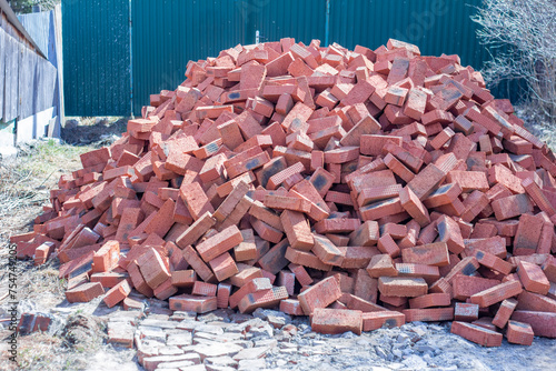 Pile of construction new red bricks for construction.