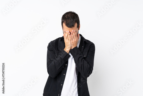 Young man with beard over isolated white background with tired and sick expression