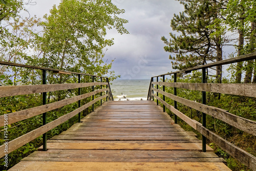 Wooden pier as an entrance to the beach