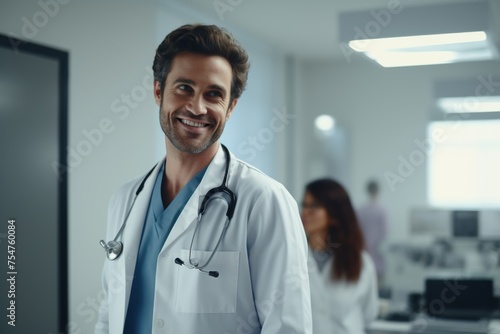 Smiling male doctor with stethoscope in clinic.