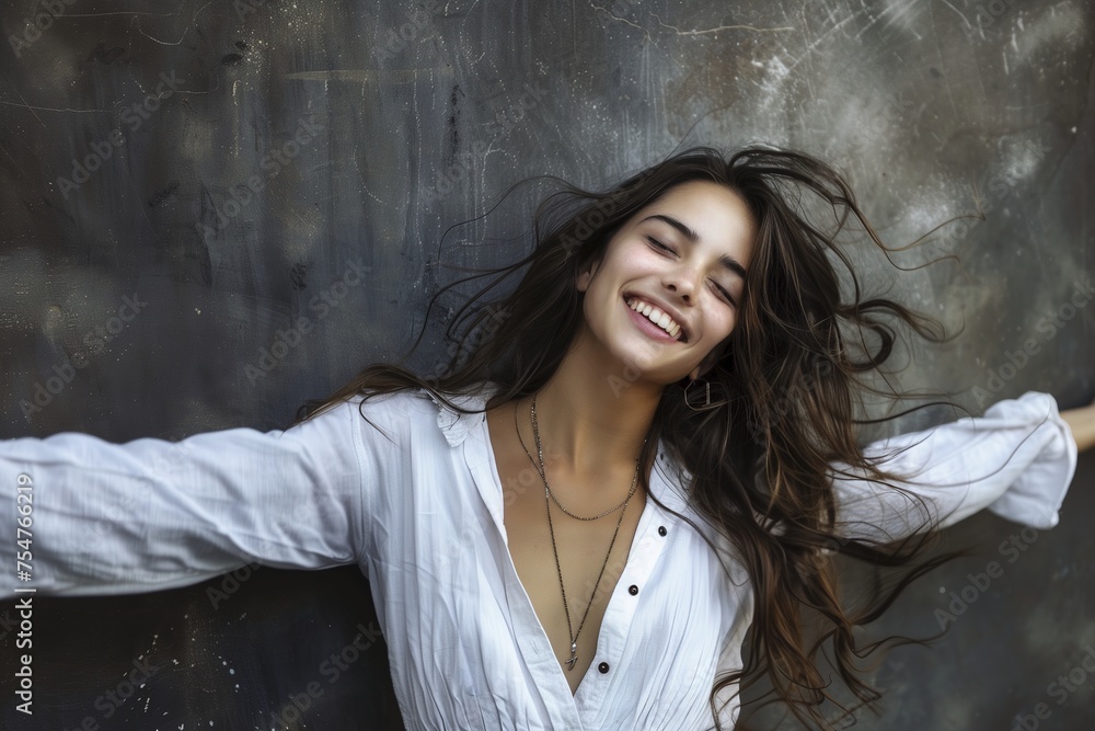 A woman with long hair is smiling and wearing a white shirt A woman with long hair is smiling and wearing a white shirt