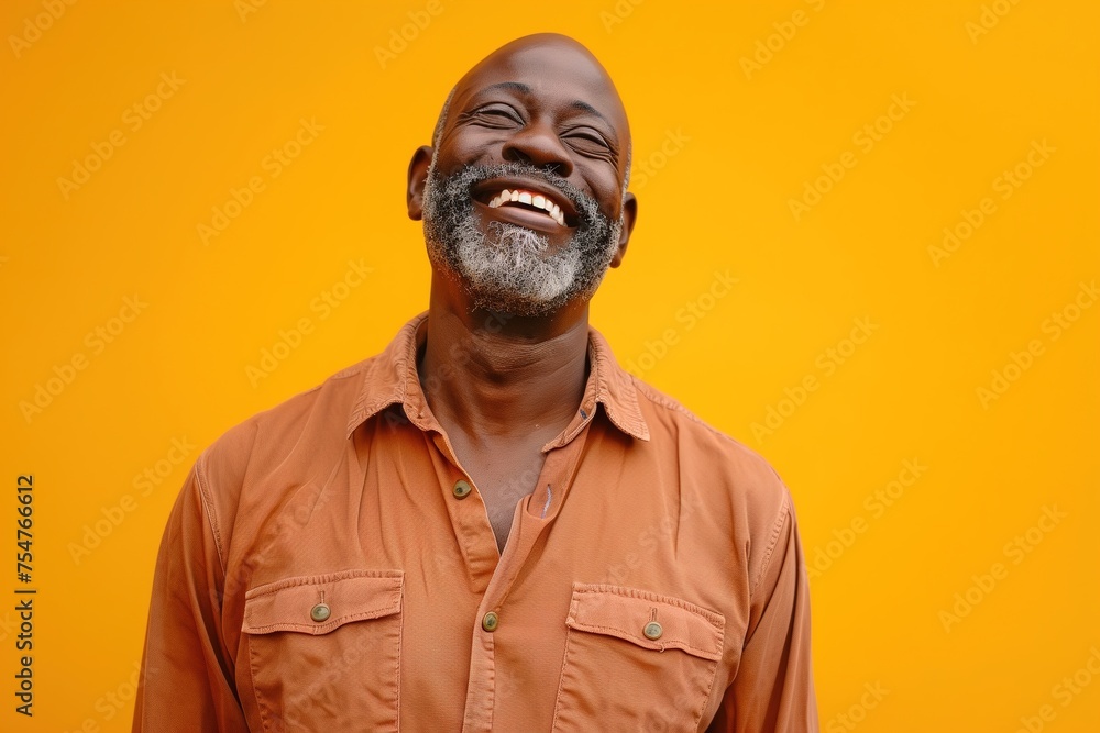 A man with a big smile on his face is wearing a red shirt A man with a big smile on his face is wearing a red shirt