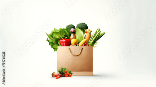 Paper bag full of fresh vegetables on white background. Healthy food concept