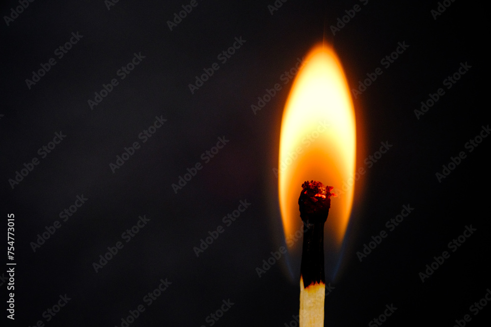 burning match on a black background burning match on a black background