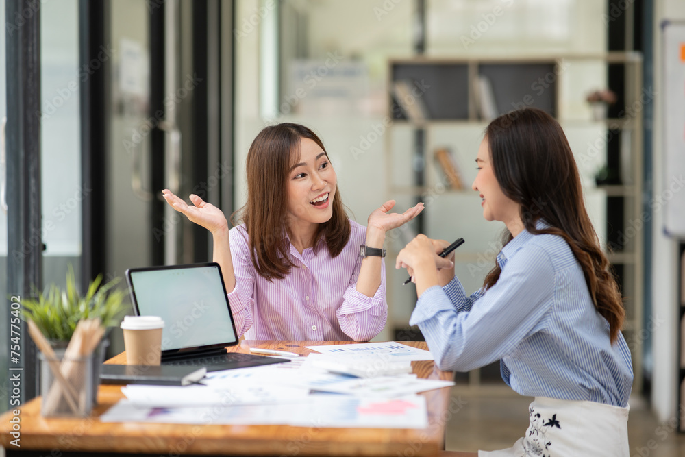 Asian business woman working and talking at the office Asian business woman working and talking at the office
