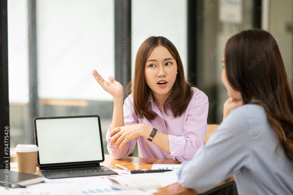 Asian business woman working and talking at the office Asian business woman working and talking at the office