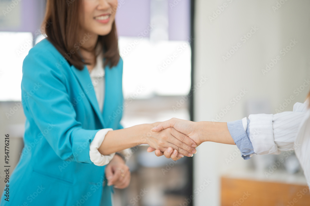 Asian business woman working and talking at the office
Asian business woman working and talking at the office
