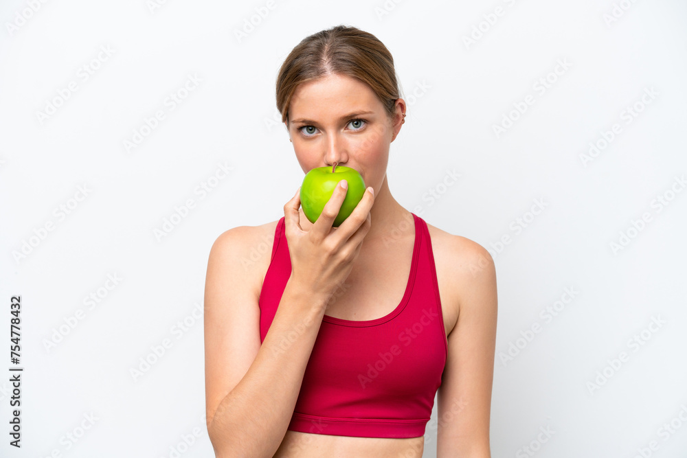 Young pretty blonde woman isolated on white background eating an apple Young pretty blonde woman isolated on white background eating an apple