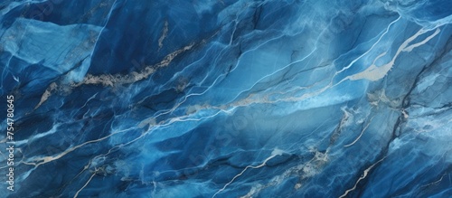 Detailed view of a blue marble surface, showcasing intricate patterns and textures found in the stone. The close-up reveals the unique characteristics of the blue marble. photo
