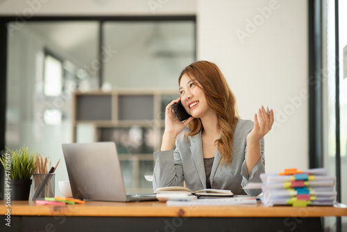 Asian businesswoman holding notebook about business, spending 