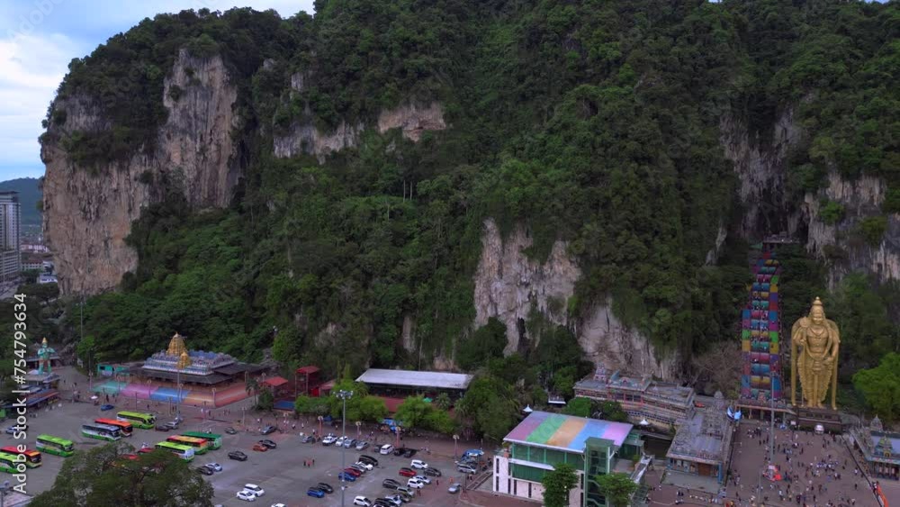 Hindu giant cave Batu golden Buddha statue Perfect aerial top view flight drone Hindu giant cave Batu golden Buddha statue Perfect aerial top view flight drone