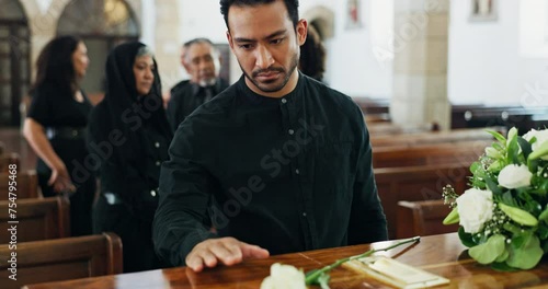 Funeral, coffin and sad man at church with flowers, mourning or grief with people at burial ceremony. Memorial service, casket and person at chapel for death, goodbye or farewell for loss with family photo