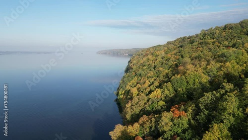 Wallpaper Mural Blue sky, smooth water surface, green and yellow forest. View from a drone. Torontodigital.ca
