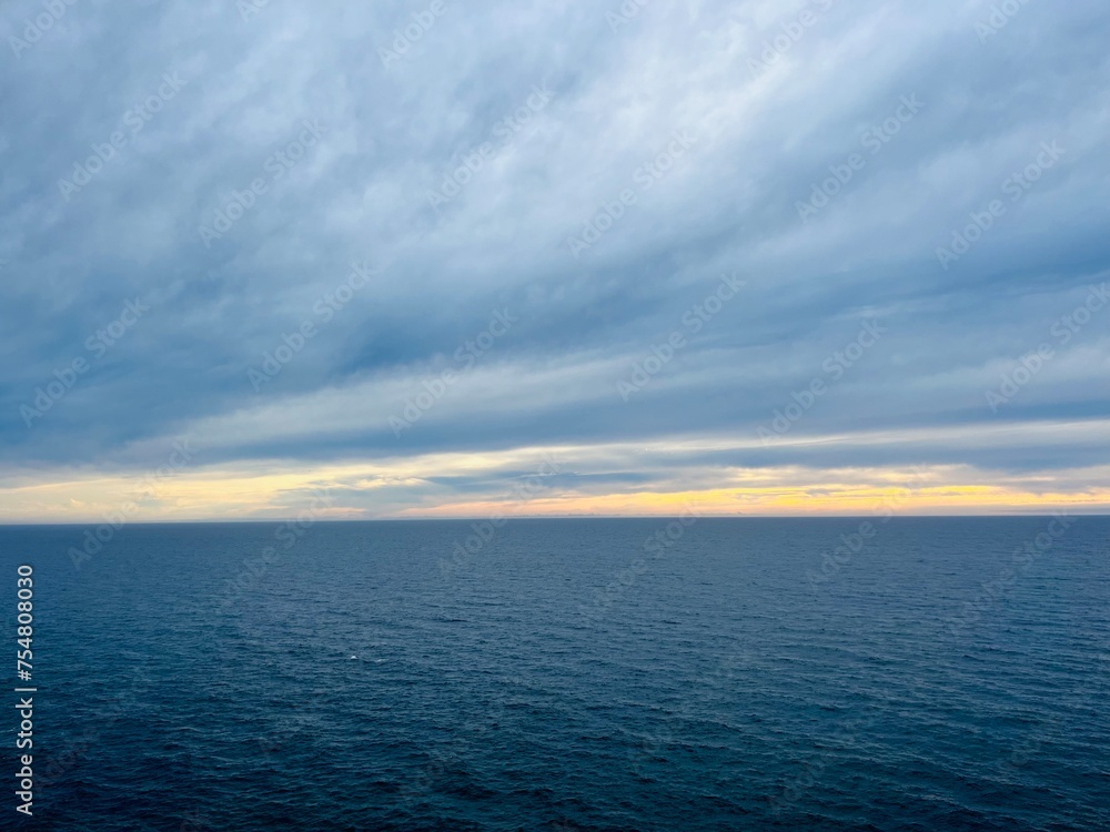 Sunset sea horizon, cloudy sky, dark cloudy sky at the seascape