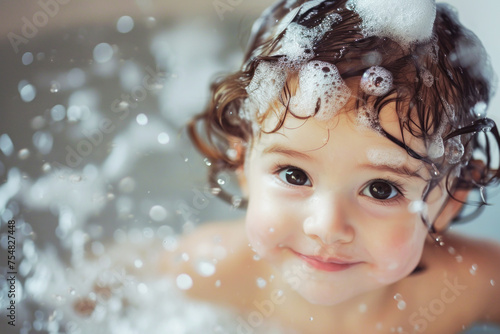 Happy time of cute baby taking a bath in bathtub