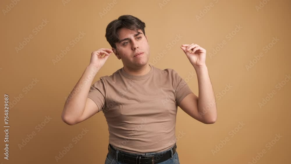 Man tired of gossip gesturing with hands imitating people speaking Man tired of gossip gesturing with hands imitating people speaking
